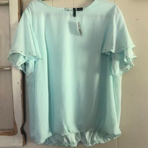 Woman’s Top New Direction